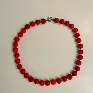 Coral necklace with silver detail and double knots between beads